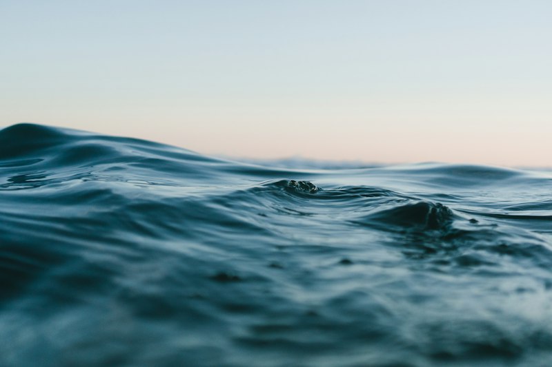 Clear coastal water over a sandy shore